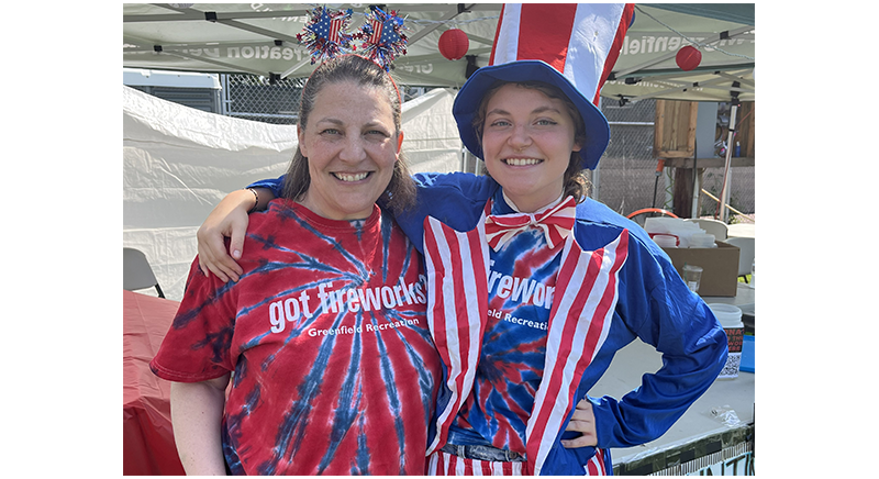 two people dressed in got fireworks t-shirts at the 4th of July fireworks celebration at Beacon Field